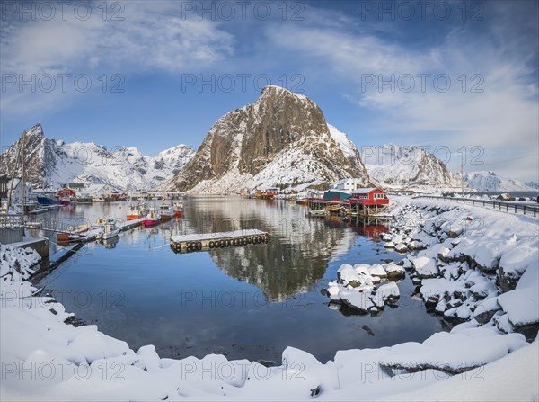 Rorbuer fishermen's cabins on the snowy fjord