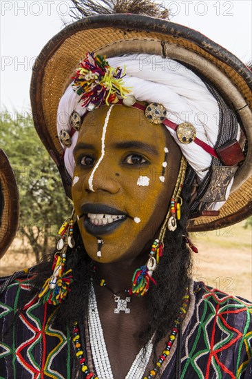 Wodaabe-Bororo man with face painted at the annual Gerewol festival