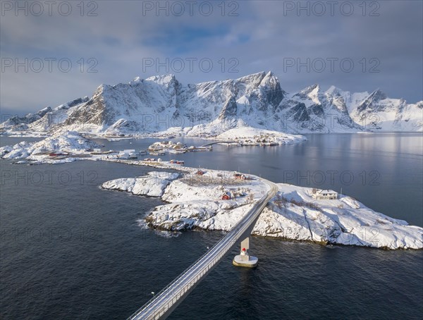 Snowy landscape by the fjord with Hamnoy bridge