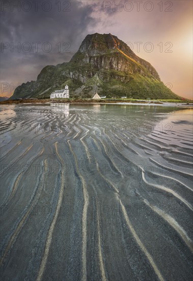 Gimsoy church in front of a sandy beach with ribbed structure