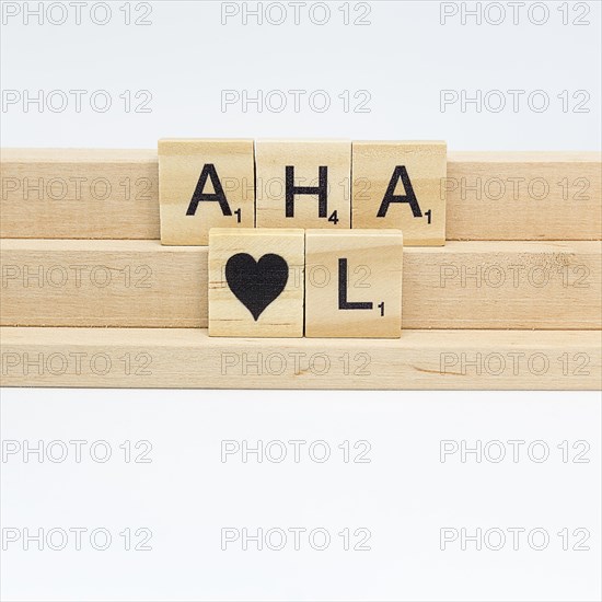 Letter stones on a wooden strip