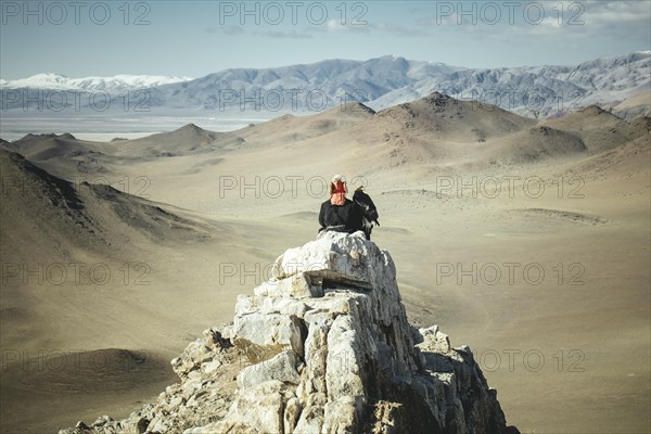 Eagle hunter Bashakhan spies with the eagle female Paimas in the valley for foxes