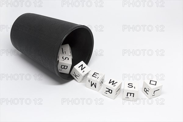 Dice cup with dice with letters and rhombus as joker