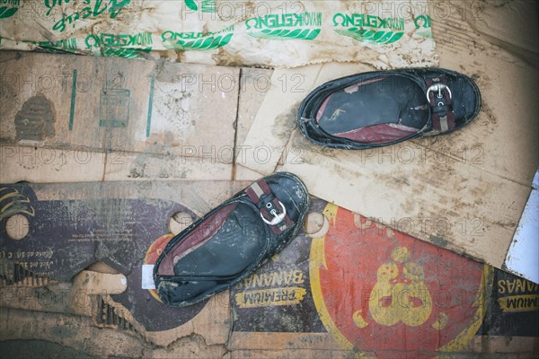 Girls' shoes in a tent