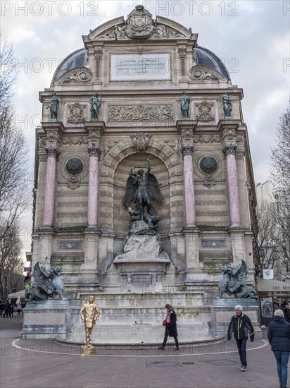 Bronze statue of the fountain La Fontaine Saint Michel at Place Saint-Michel