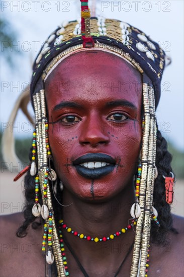 Wodaabe-Bororo man with face painted at the annual Gerewol festival