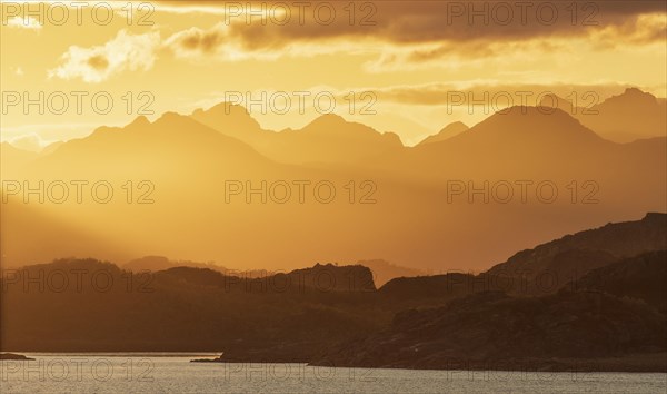Atmospheric sunset over a high mountain range