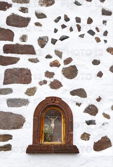 Martyrdom on a house wall in the mountain village Masca