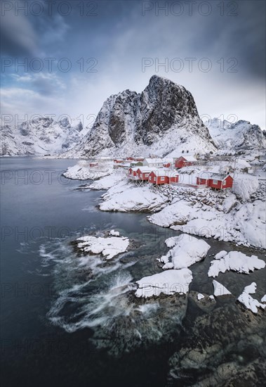 Rorbuer fishermen's cabins on the snowy fjord