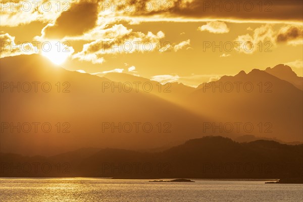 Atmospheric sunset over a high mountain range