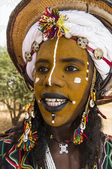 Wodaabe-Bororo man with face painted at the annual Gerewol festival