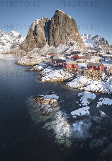 Rorbuer fishermen's cabins on the snowy fjord