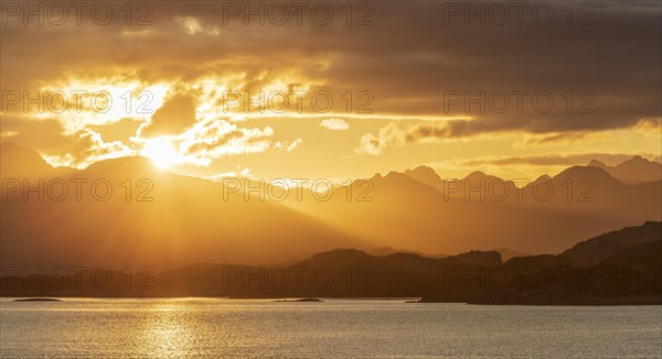 Atmospheric sunset over a high mountain range