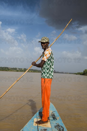 Man in front of a boat