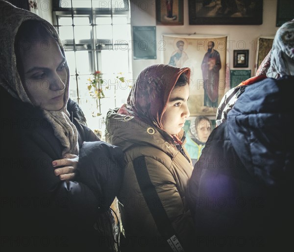 Believers during an exorcism in the church of Father Sergei in Ochamchira