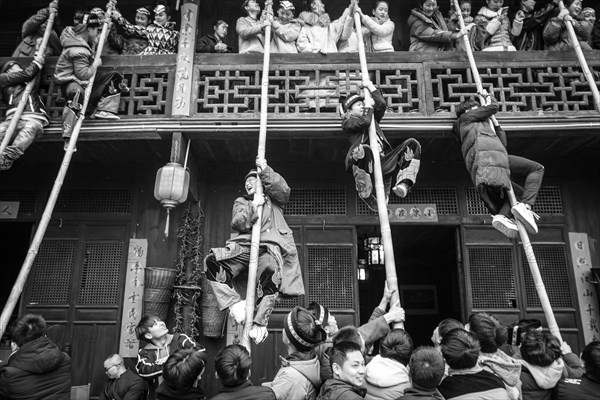 Young people preparing a production in which they rob unmarried woman from a balcony