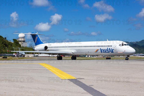 A McDonnell Douglas MD-83 of the island Air with registration number P4-MDG at the airport of St