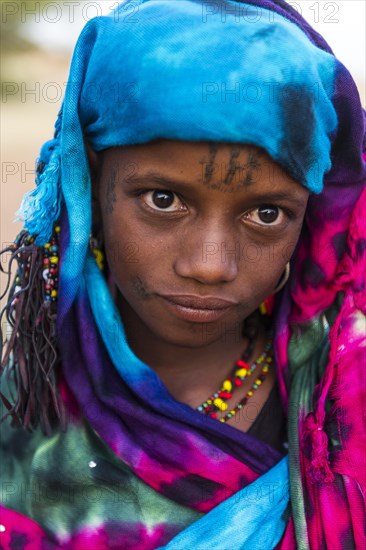 Colourful dressed girl at the Gerewol festival