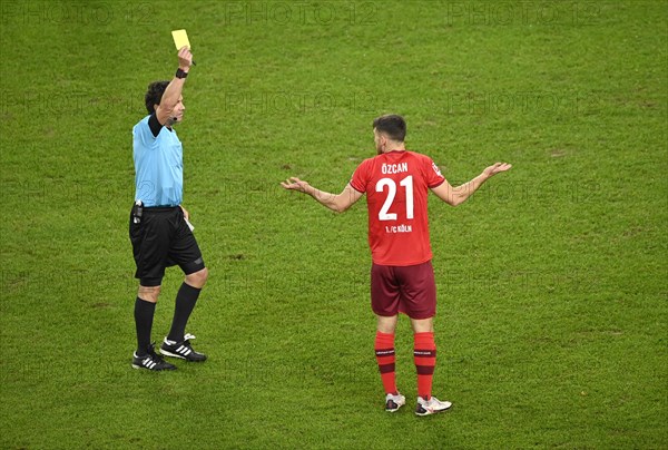 Referee Guido Winkmann draws Salih Oezcan 1 FC Koeln yellow card