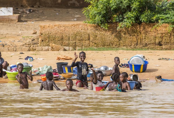 Children washing and playing Niger river