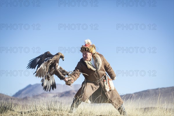 Spai Bashakan trains his female eagle