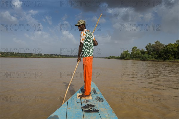 Man in front of a boat