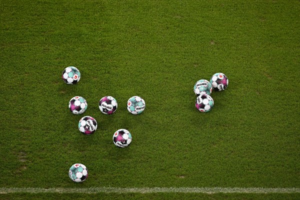 11 match balls adidas Derbystar 2020/21 lie on the turf of the Mercedes-Benz Arena