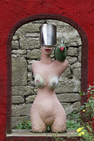 Naked Amazon with helmet and bird