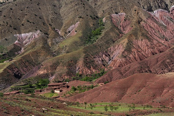 Erosion landscape with small clay village of the Berbers