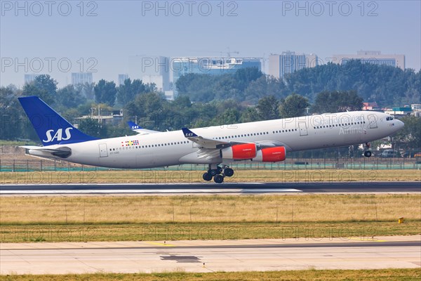An Airbus A340-300 aircraft of SAS Scandinavian Airlines with registration OY-KBD at Beijing Airport