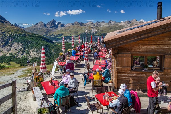 Sun terrace of the Alp Languard mountain inn above the Bernina Valley