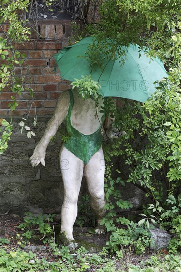 Woman in a bathing suit with umbrella