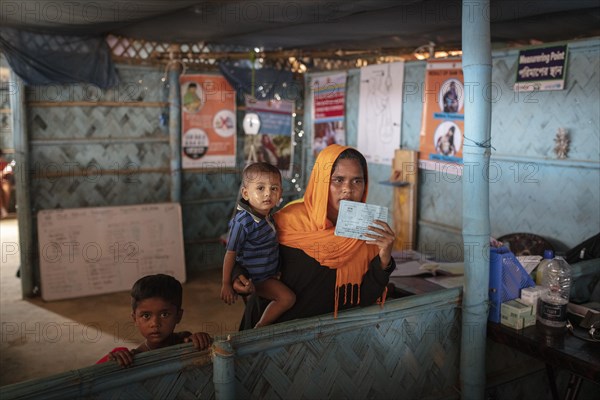A mother with her children in a medical station in the camp for Rohingya refugees from Myanmar