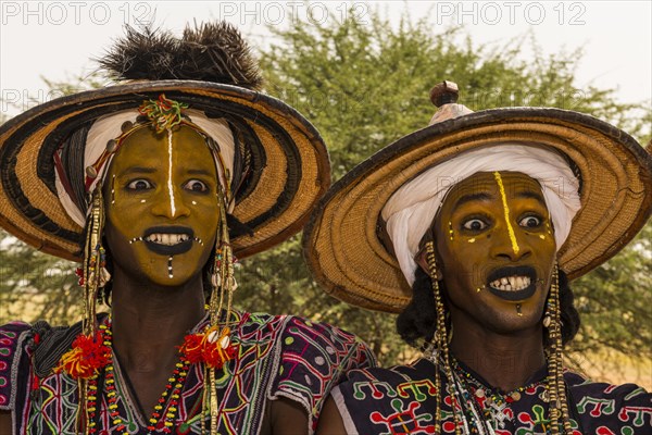 Wodaabe-Bororo men with faces painted at the annual Gerewol festival