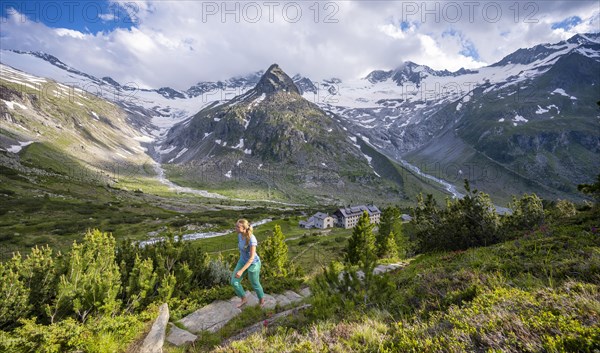 Hiker on the way to the Berliner Huette on the Berliner Hoehenweg