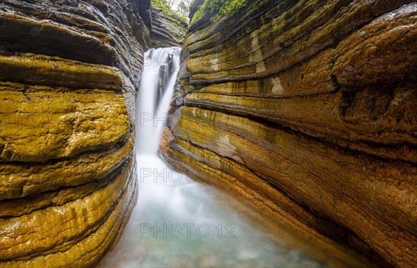 The Taugl or Tauglbach flows through the red gorge