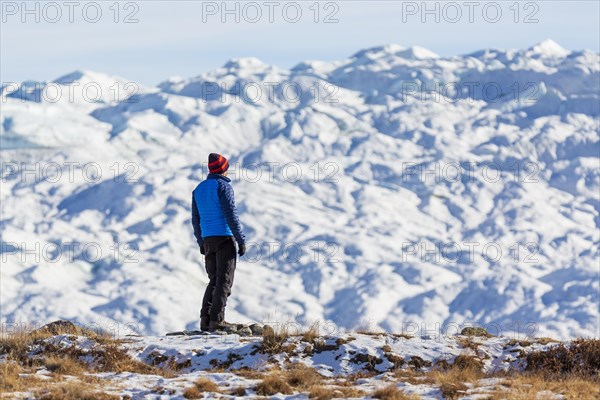 Man looking at inland ice near Kangerlussuaq