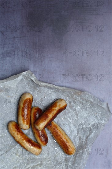 Several Chipolata sausages