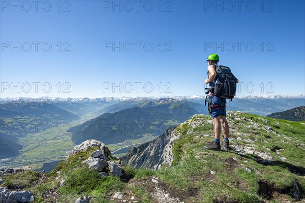 Hiker looks down into the Inn valley