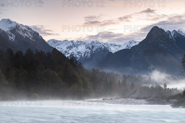 River Soca with Svinjak Mountain in the morning