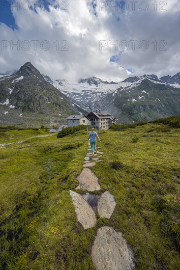 Hiker on the way to the Berliner Huette on the Berliner Hoehenweg