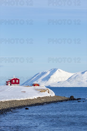 Lonely red house on the Akureyrifjord