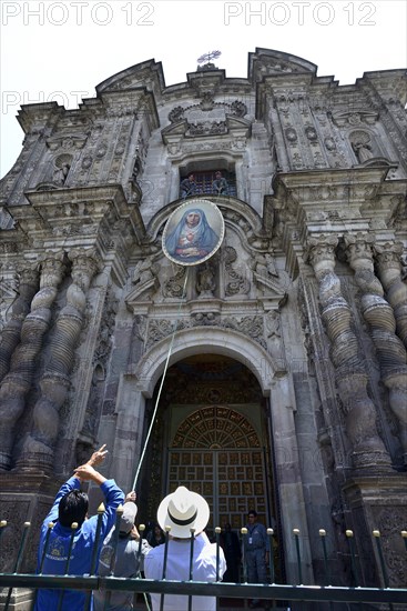 A picture of the Virgin Mary is attached to the facade