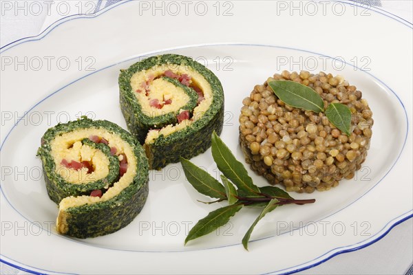 Polenta Spinach Roulade with Alblinsen arranged on a serving plate