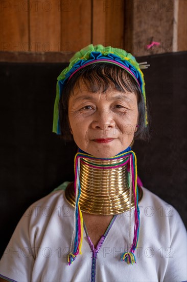 Long necked woman with several brass rings around her neck