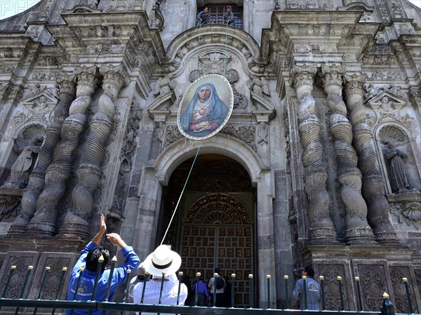 A picture of the Virgin Mary is attached to the facade