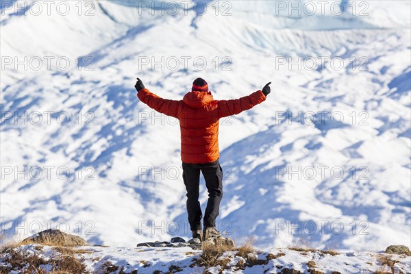 Man looking at inland ice near Kangerlussuaq