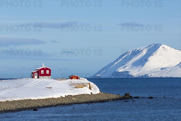 Lonely red house on the Akureyrifjord