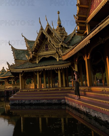 Hexagonal golden temple with standing person