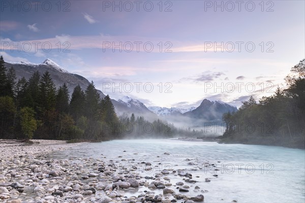 River Soca with Svinjak Mountain in the morning